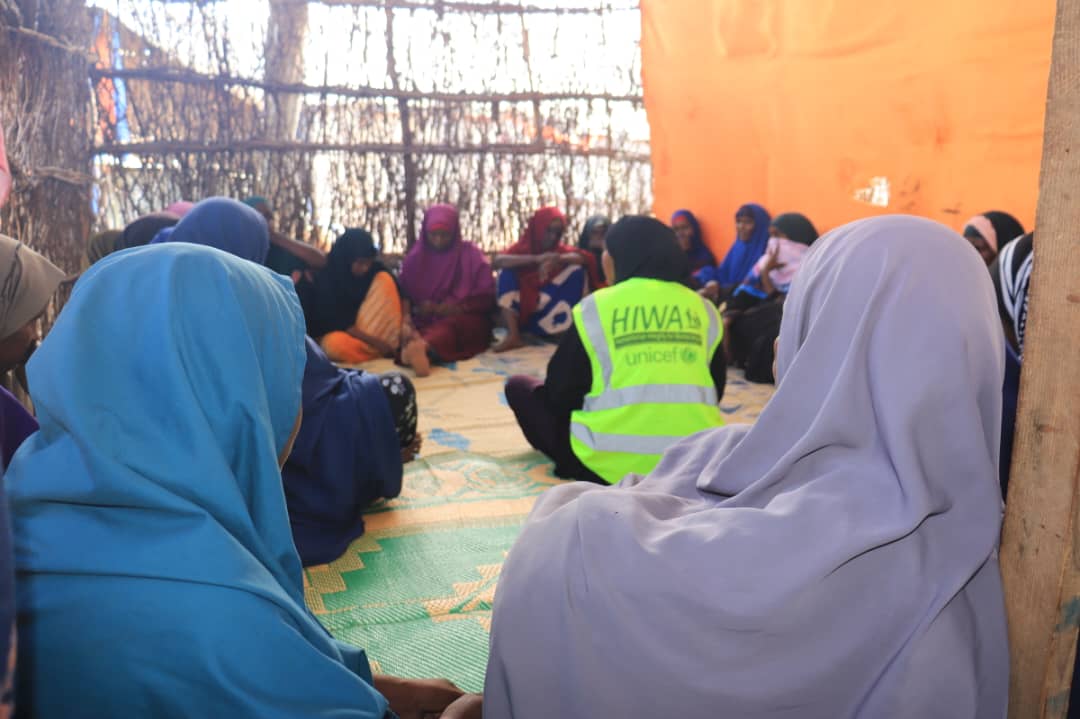 Women attending a community session with a HIWA facilitator