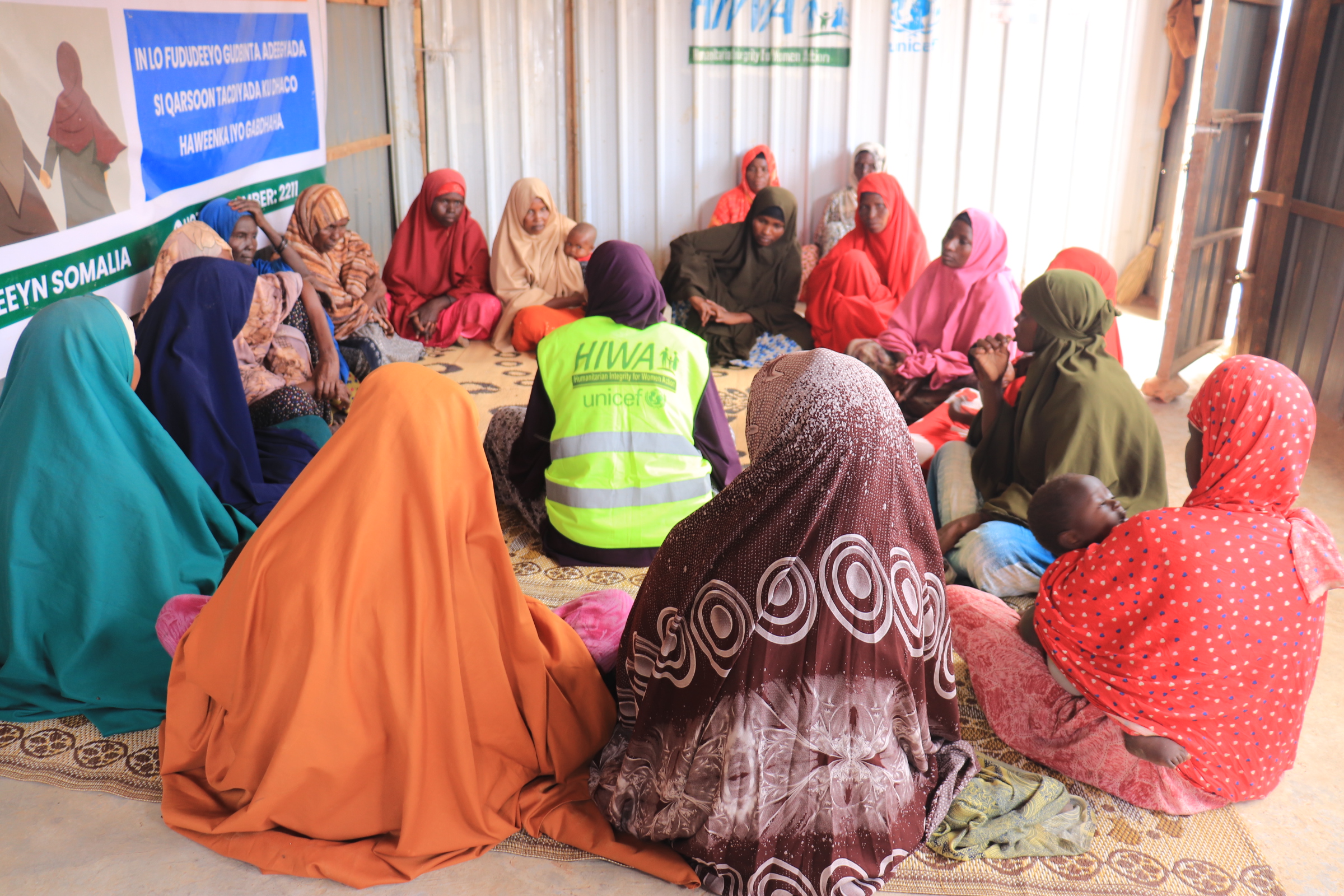 HIWA facilitator leading a discussion with women in a community space